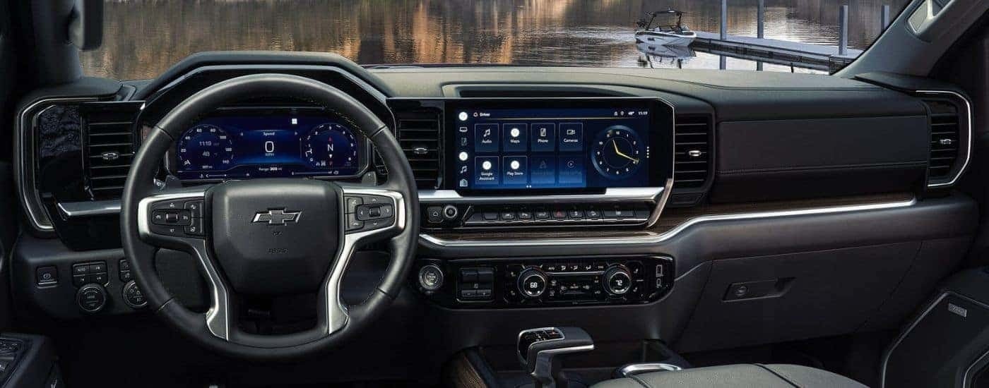 A close up shows the black dash and infotainment screen in a 2024 Chevy Silverado 1500.