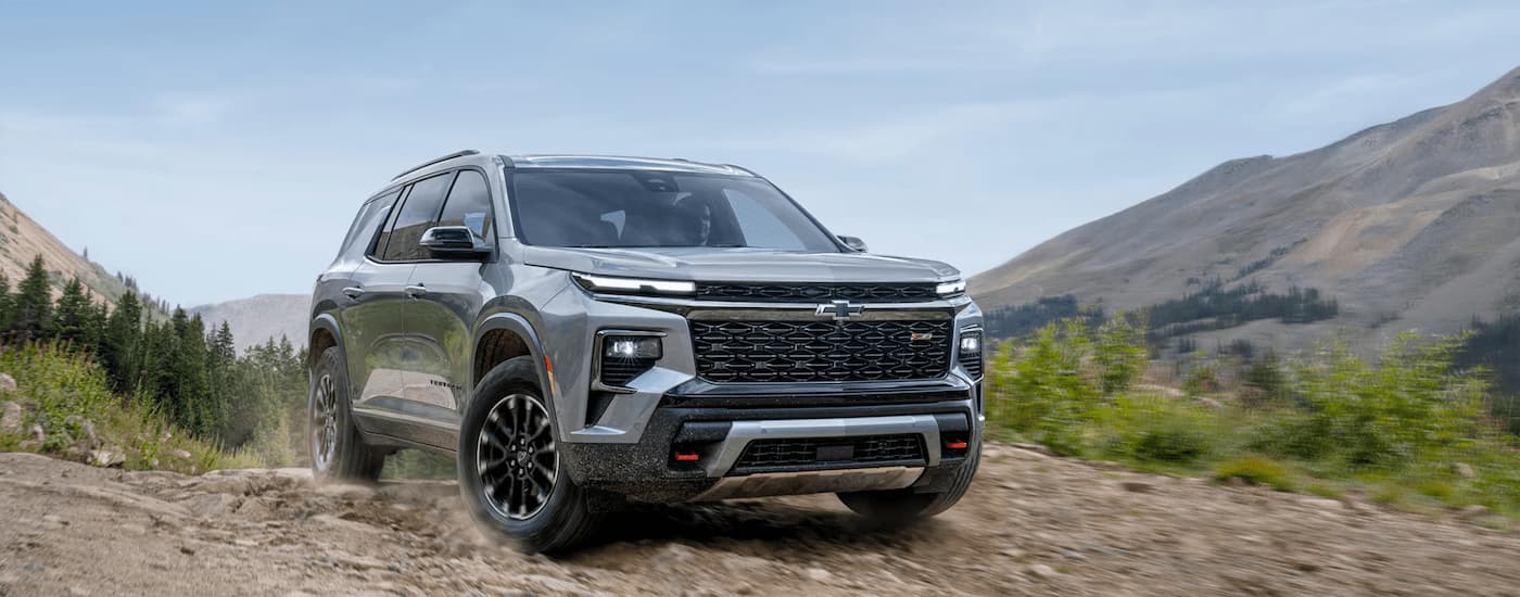 Grey 2026 Chevy Traverse off-roading on a rocky trail