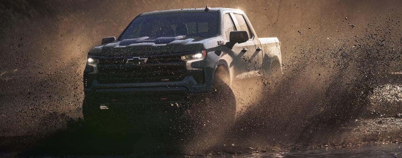 A blue 2026 Chevy Silverado 1500 ZR2 off-roading.