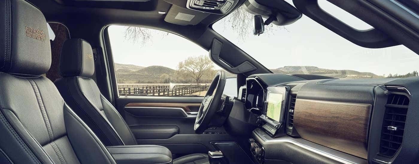 Side view of the wood and leather cabin in a 2024 Chevy Silverado 1500 High Country for sale