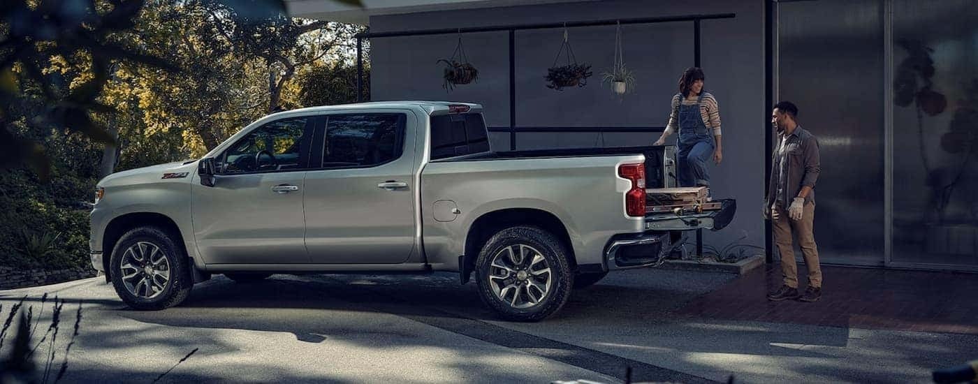 A grey 2023 Chevy Silverado 1500 is shown from the side after leaving a Chevy truck dealer near Gardendale AL.