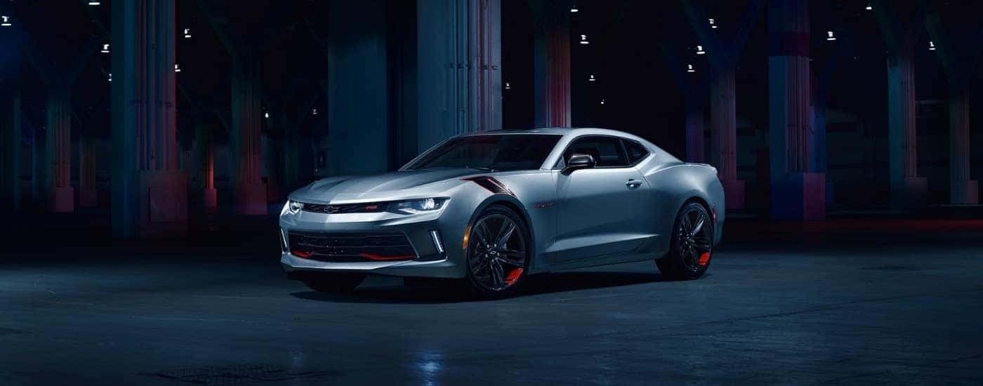 A silver 2017 Chevy Camaro Redline is shown parked in a warehouse.